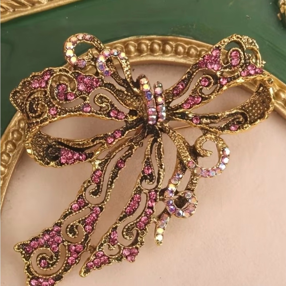 Elegant Gold and Pink Bow Brooch